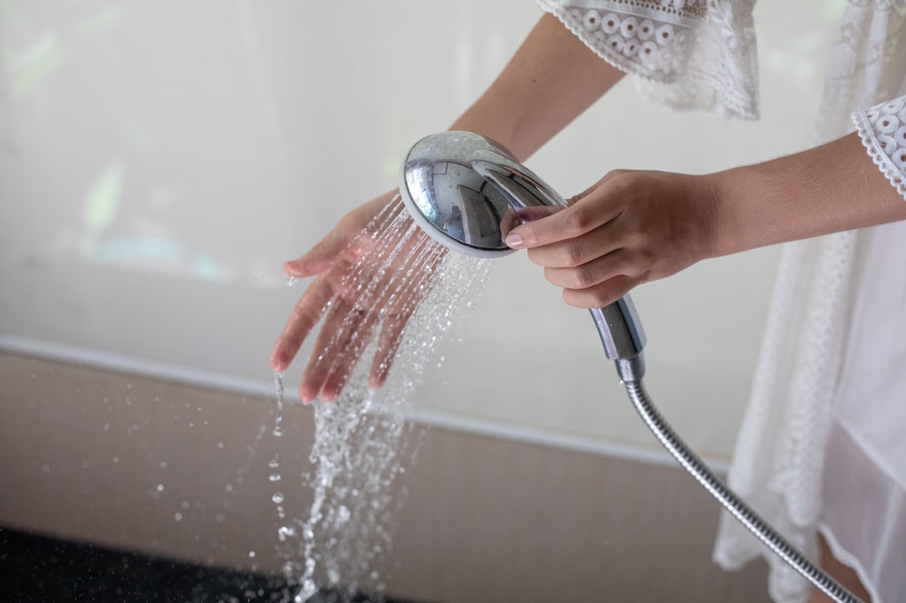 checking the water with detachable showerhead