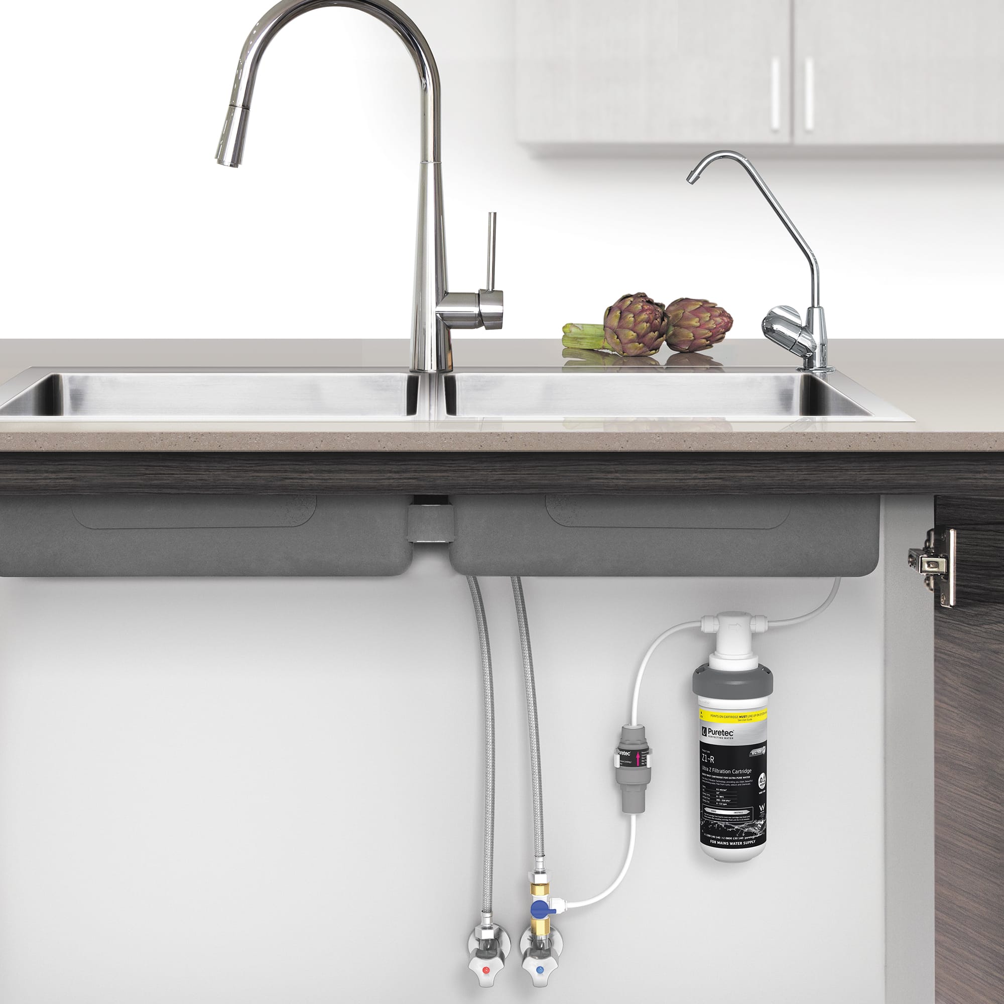 Puretec z12 undersink water filtration system installed beneath a modern kitchen sink. Compact and efficient design with a sleek chrome tap, providing high-quality filtered drinking water in perth homes.